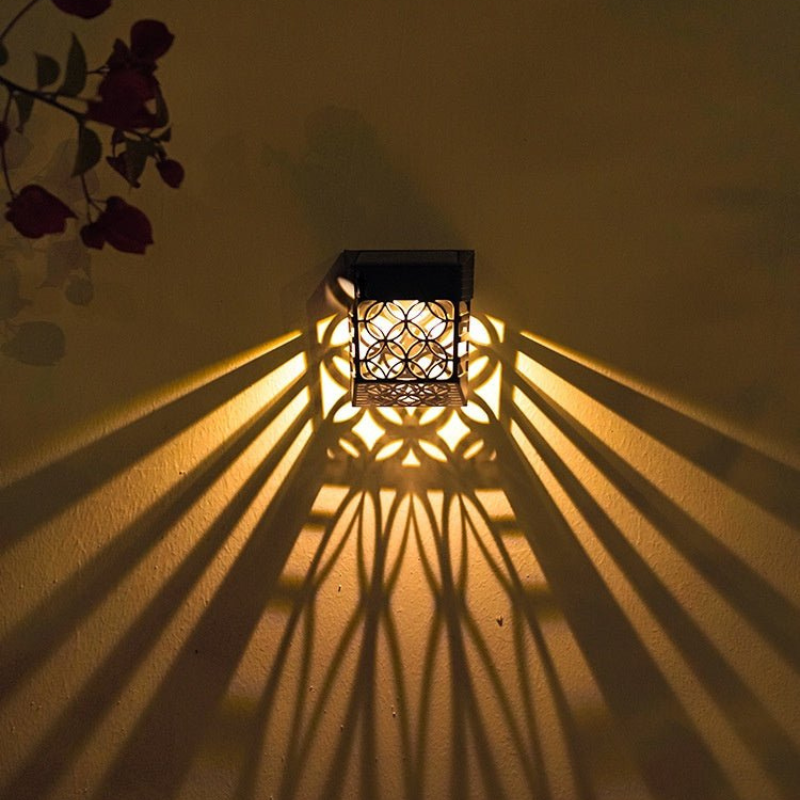 Decorative wall light casting shadows on a wall