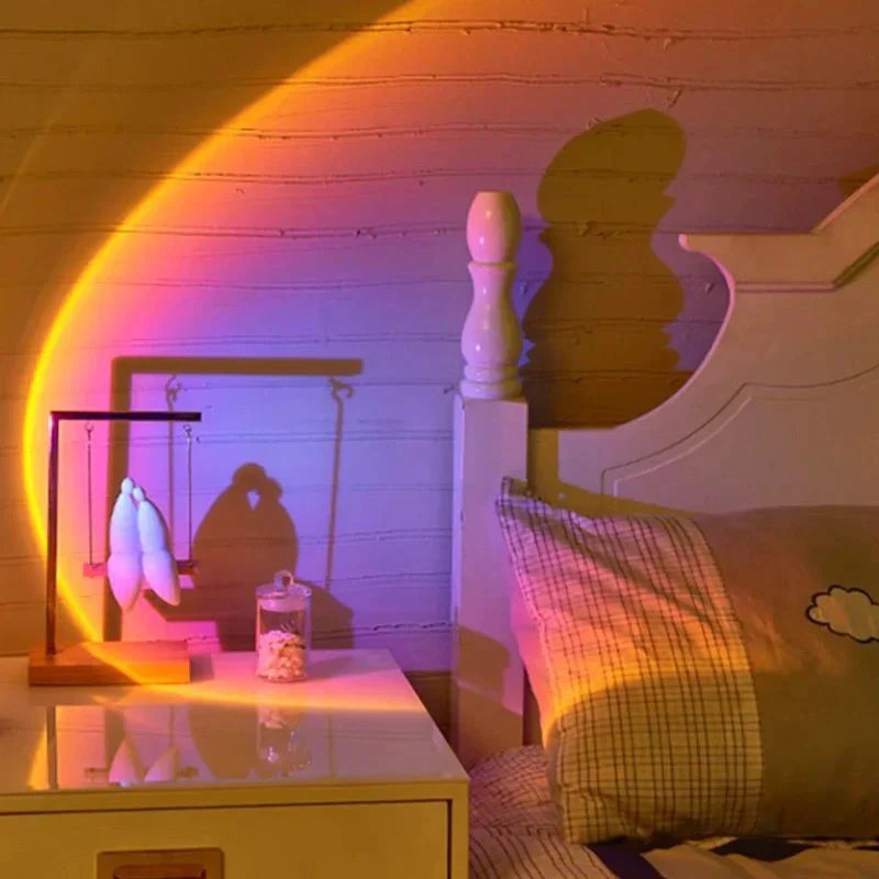Room interior with a bed and nightstand, illuminated by a rainbow light effect.