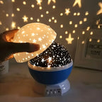 Starry night light projector casting star patterns on a wall