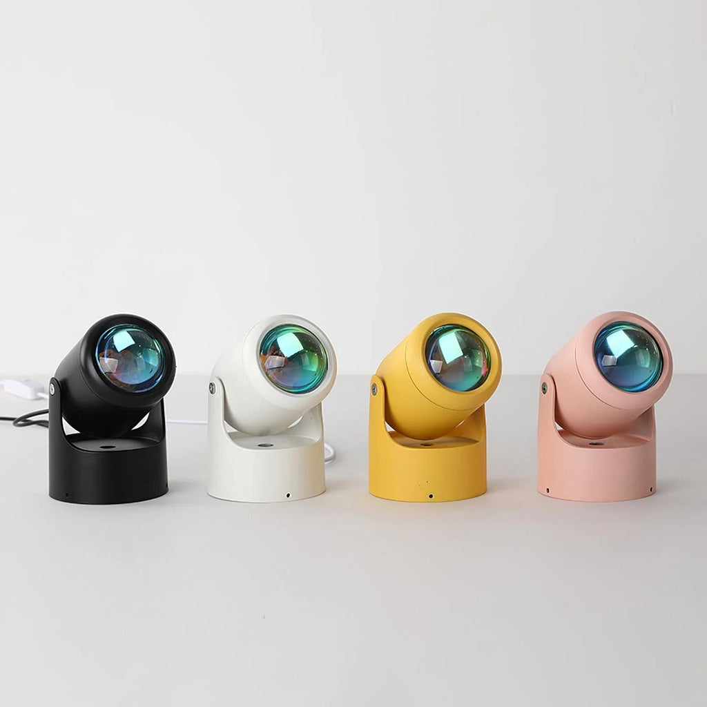 Four colorful spotlight lamps on a white background
