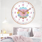 Colorful wall clock on a wall above a bed in a bedroom setting