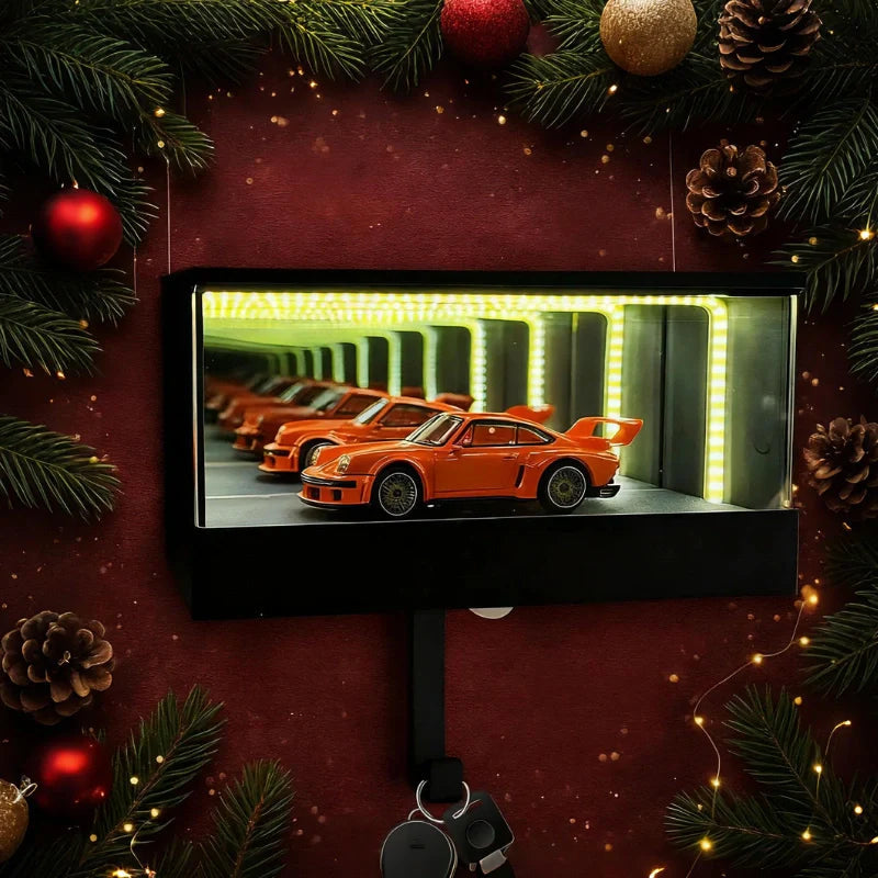 Small screen displaying an orange car in a row, surrounded by Christmas decorations.