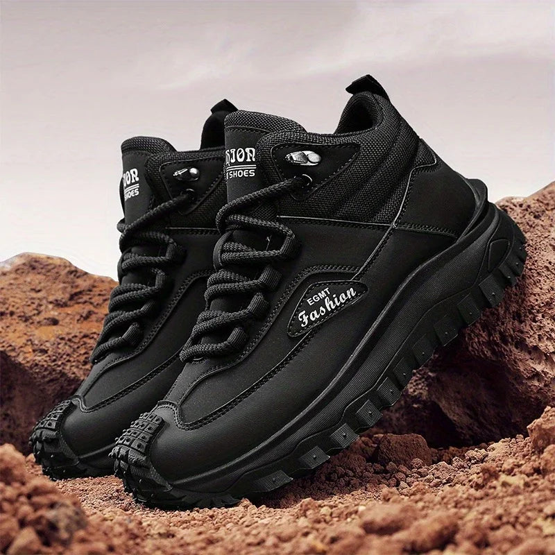 Black hiking boots with 'Fashion' branding on a rocky background