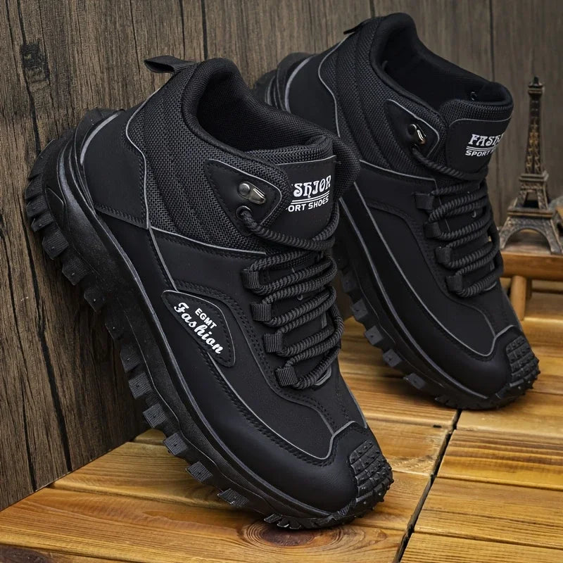 Black athletic shoes with brand name on wooden surface
