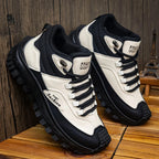 Black and white sneakers on a wooden surface with a wooden wall background