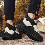 Black and white sneakers with thick soles on a natural background