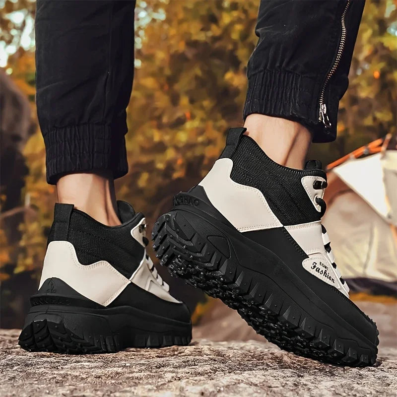 Black and white sneakers with thick soles on a natural background