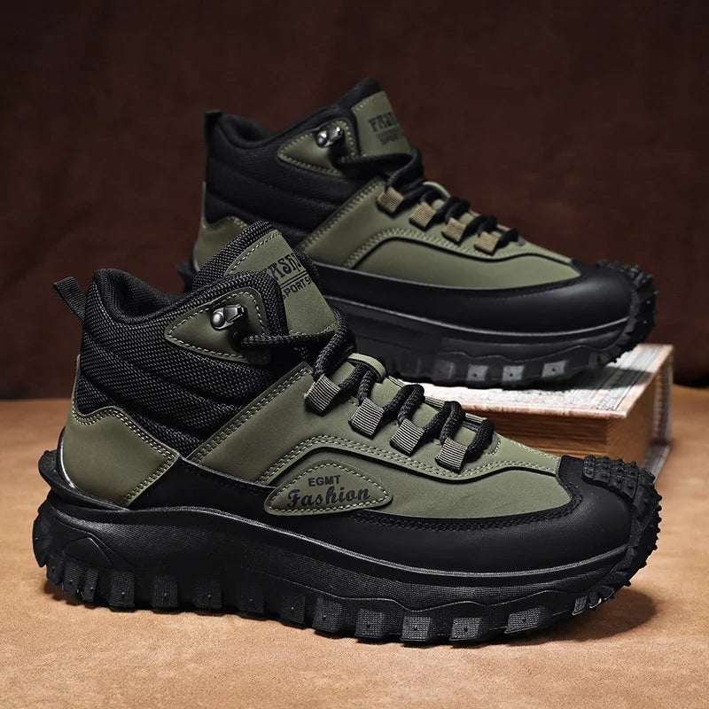 Green and black hiking boots on a brown surface with a dark background