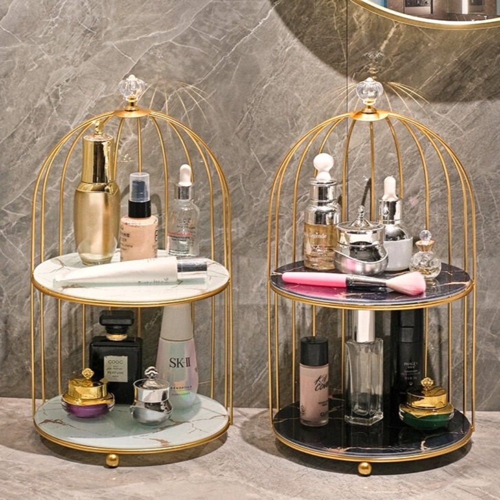 Two gold-framed cosmetic organizers with various skincare products on a marble surface.