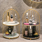 Two gold-framed cosmetic organizers with various skincare products on a marble surface.