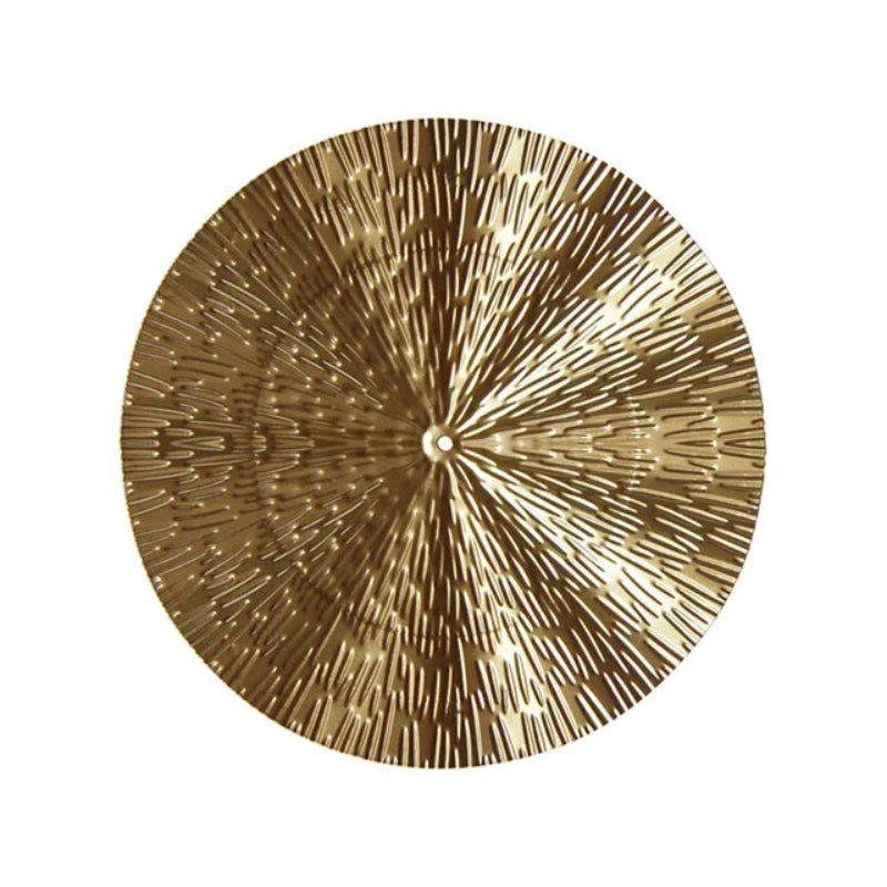 Decorative wall plate with a sunburst design on a white background