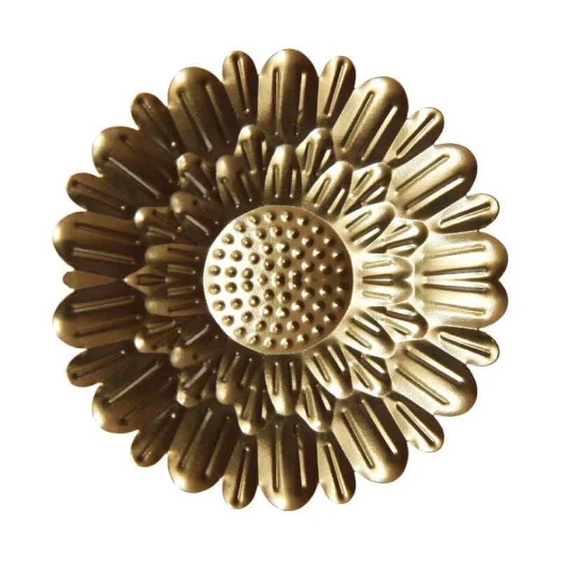 Gold floral design on a white background