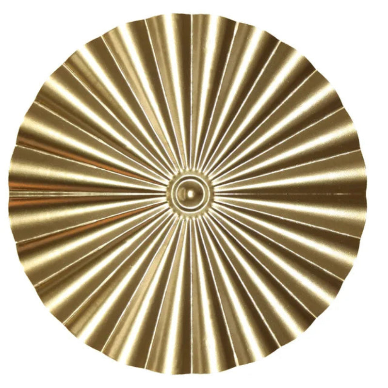 Gold decorative plate with sunburst pattern on a white background