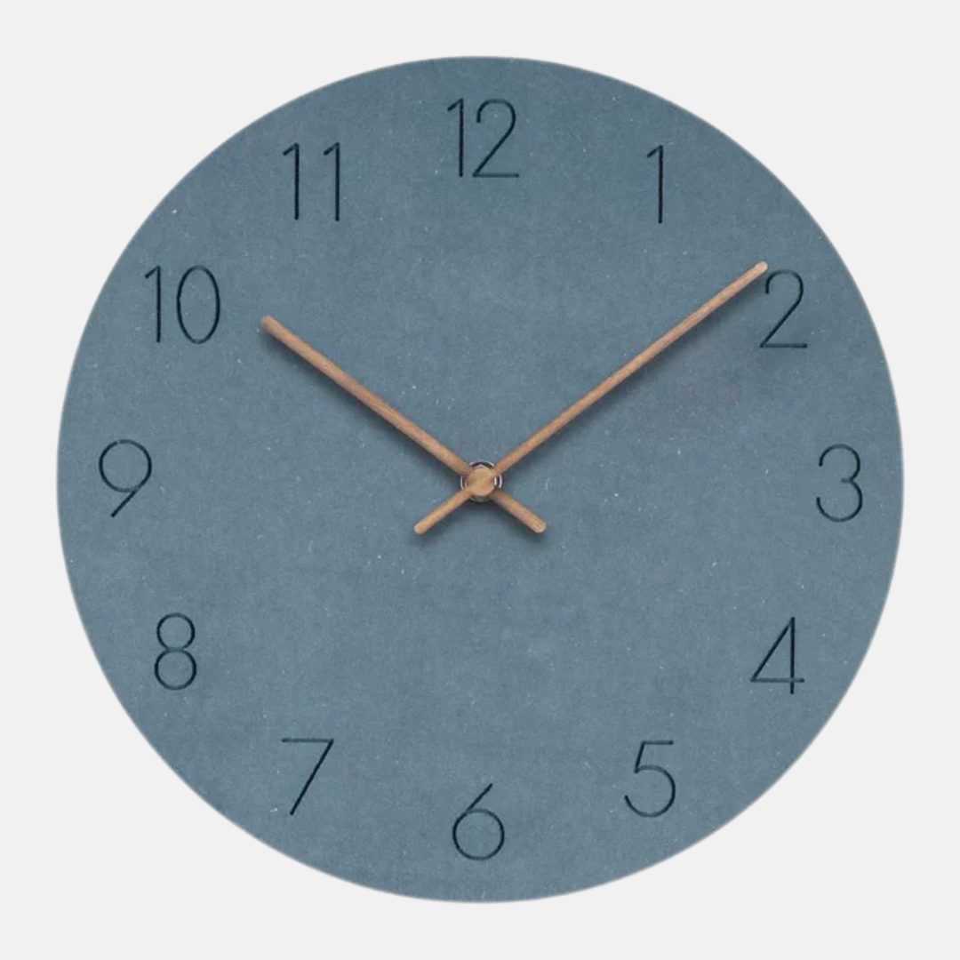 Round wall clock with blue face and bronze hands on a white background