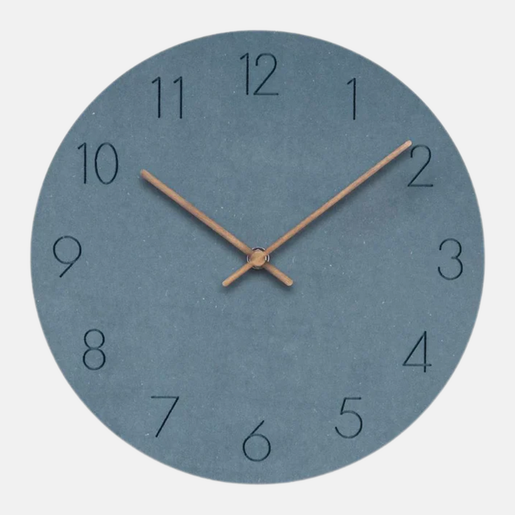 Round wall clock with blue face and bronze hands on a white background