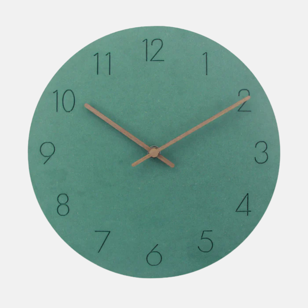 Green wall clock with brown hands on a light gray background