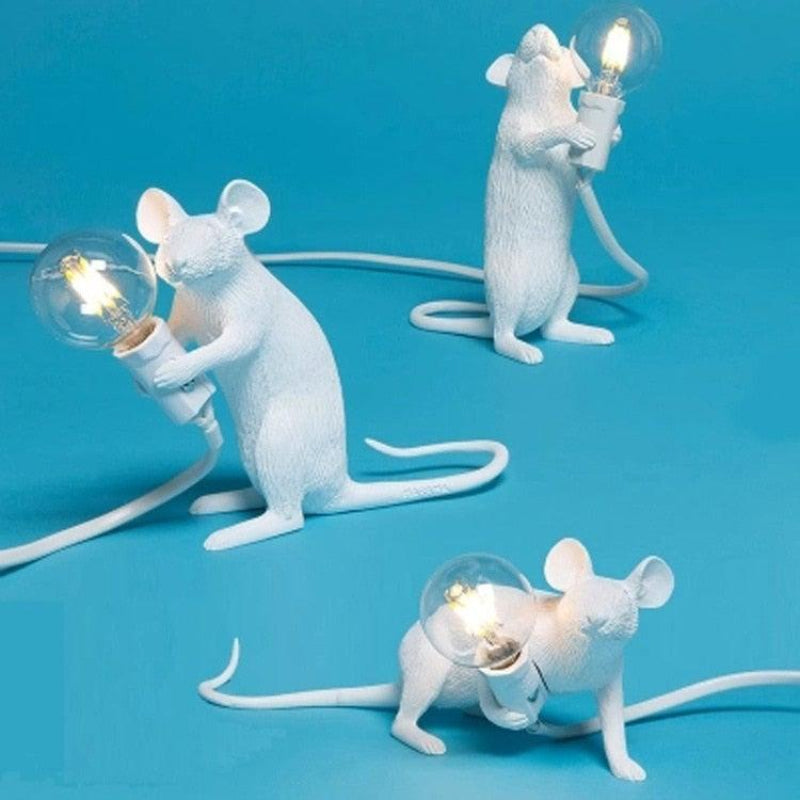 White mouse-shaped lamps with light bulbs on a blue background