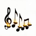 Decorative candles shaped like musical notes on a white background