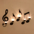 Decorative wall sconces shaped like musical notes on a white wall.