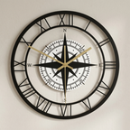 Decorative wall clock with compass design on a plain background