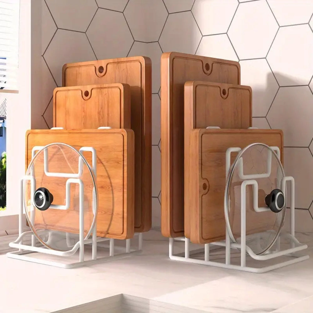 Set of wooden cutting boards with glass lids on a white stand against a geometric-patterned wall.
