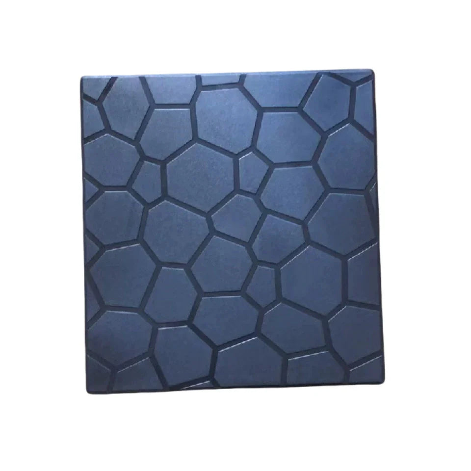 Blue decorative tile with geometric pattern on a white background