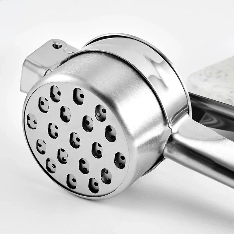 Close-up of a metal hand grinder on a white background