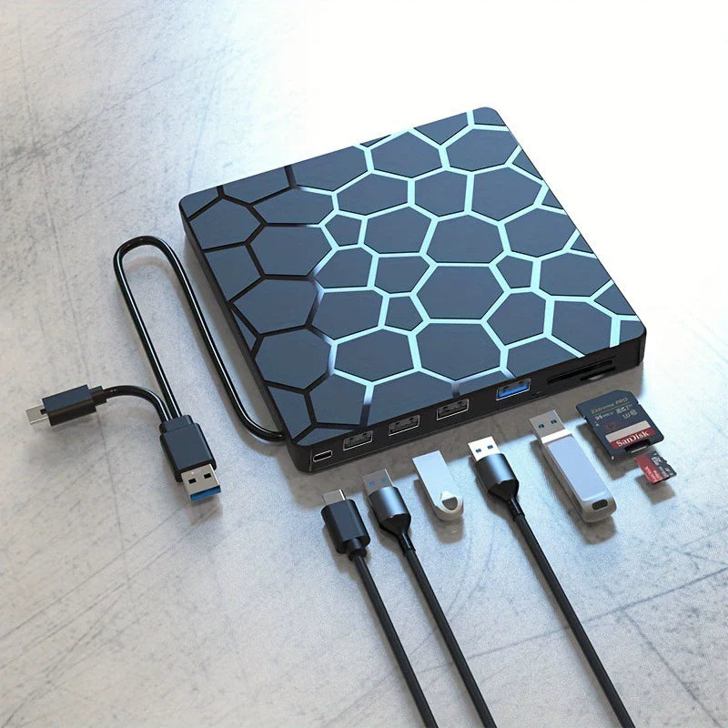 Hexagonal patterned electronic device with cables and cards on a light surface