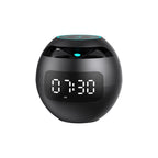 Black digital clock with LED display on a white background