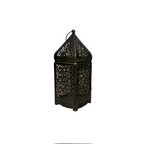 A dark metal lantern with intricate cutout patterns on its body and a pointed top, shown against a plain white background.