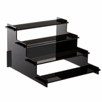 Black glass shelf unit on a white background