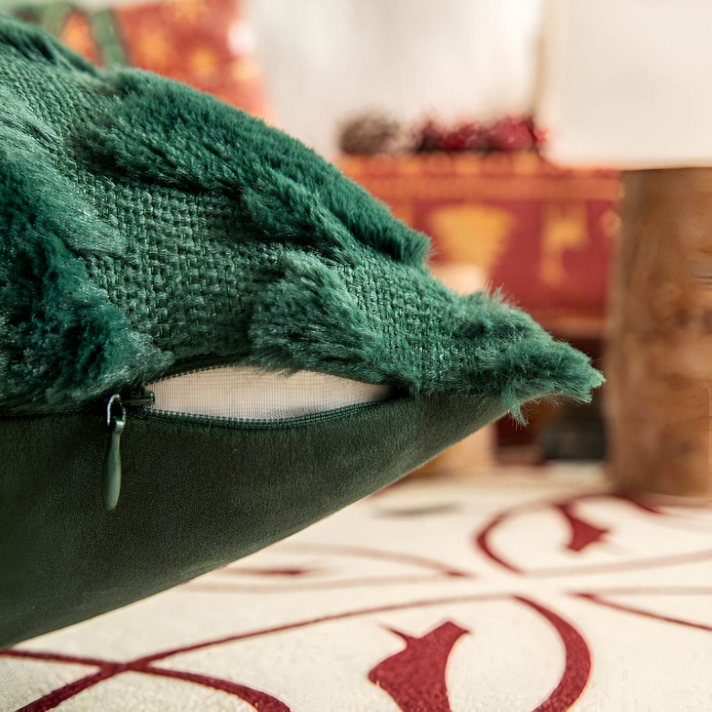 Close-up of a green textured blanket on a surface with a blurred background
