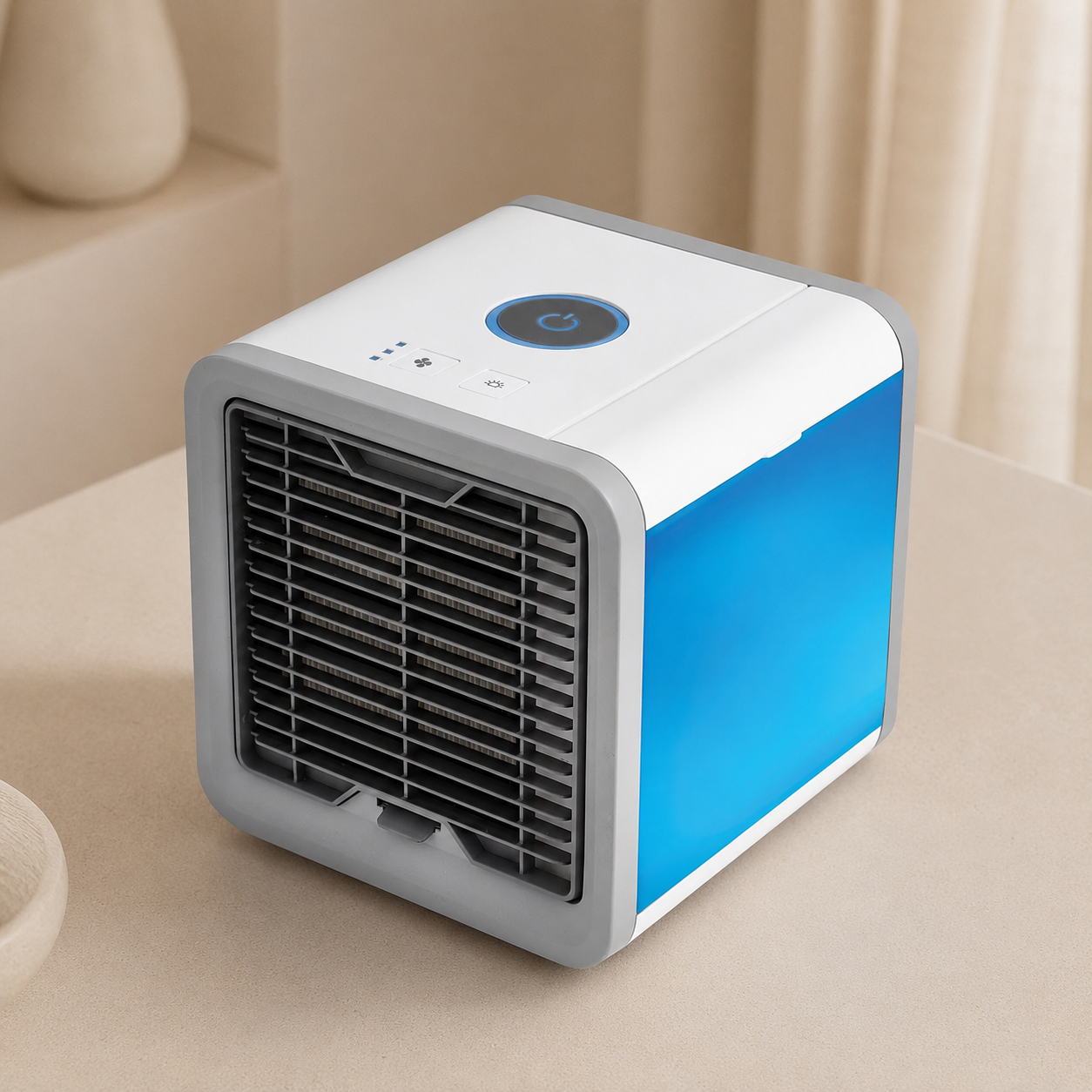 Portable air cooler with blue and gray design on a beige surface