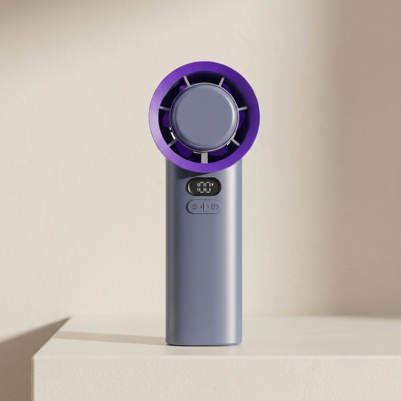 Portable fan with purple top and gray body on a beige background