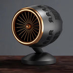Decorative object resembling a jet engine on a wooden surface with a dark background