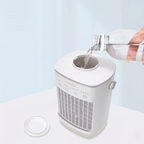 Person pouring water into a white humidifier on a light blue background