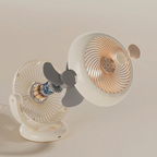 Two white fans with gold accents on a beige background
