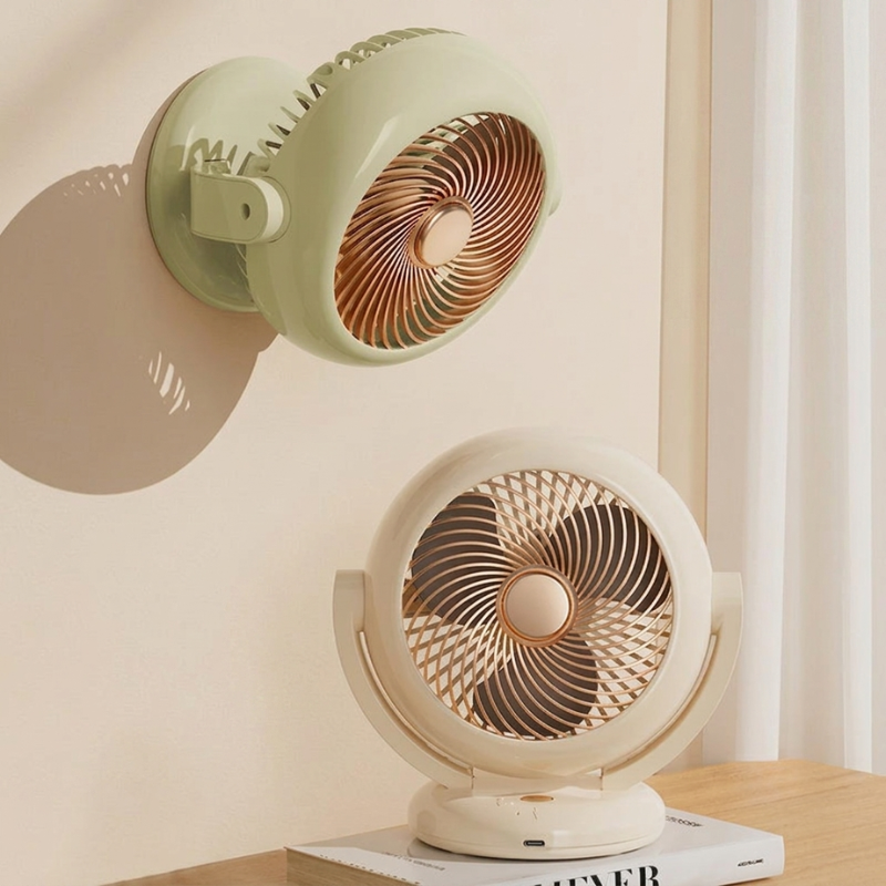 Two vintage-style fans on a table with a neutral background