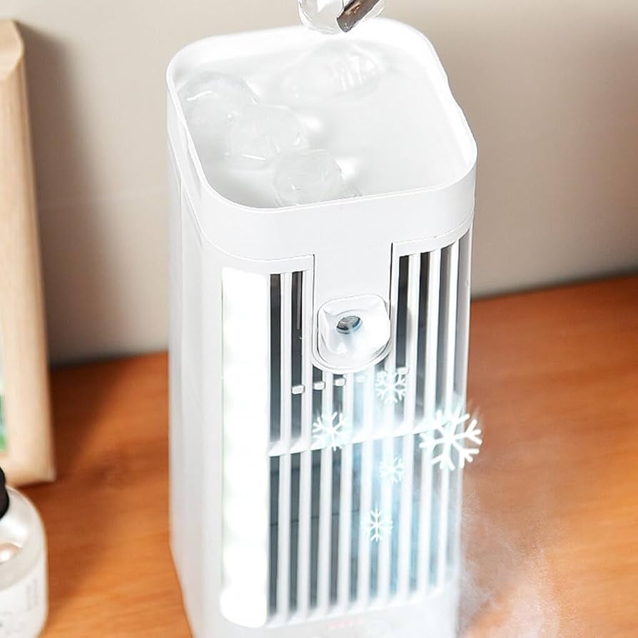 White portable fan on a wooden surface with a neutral background