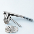 Metallic garlic press with three interchangeable discs on a light blue background