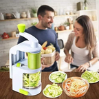 Veggie spiralizer on a kitchen counter with a man and woman in the background