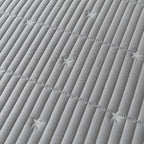 Close-up of a textured gray fabric with star patterns