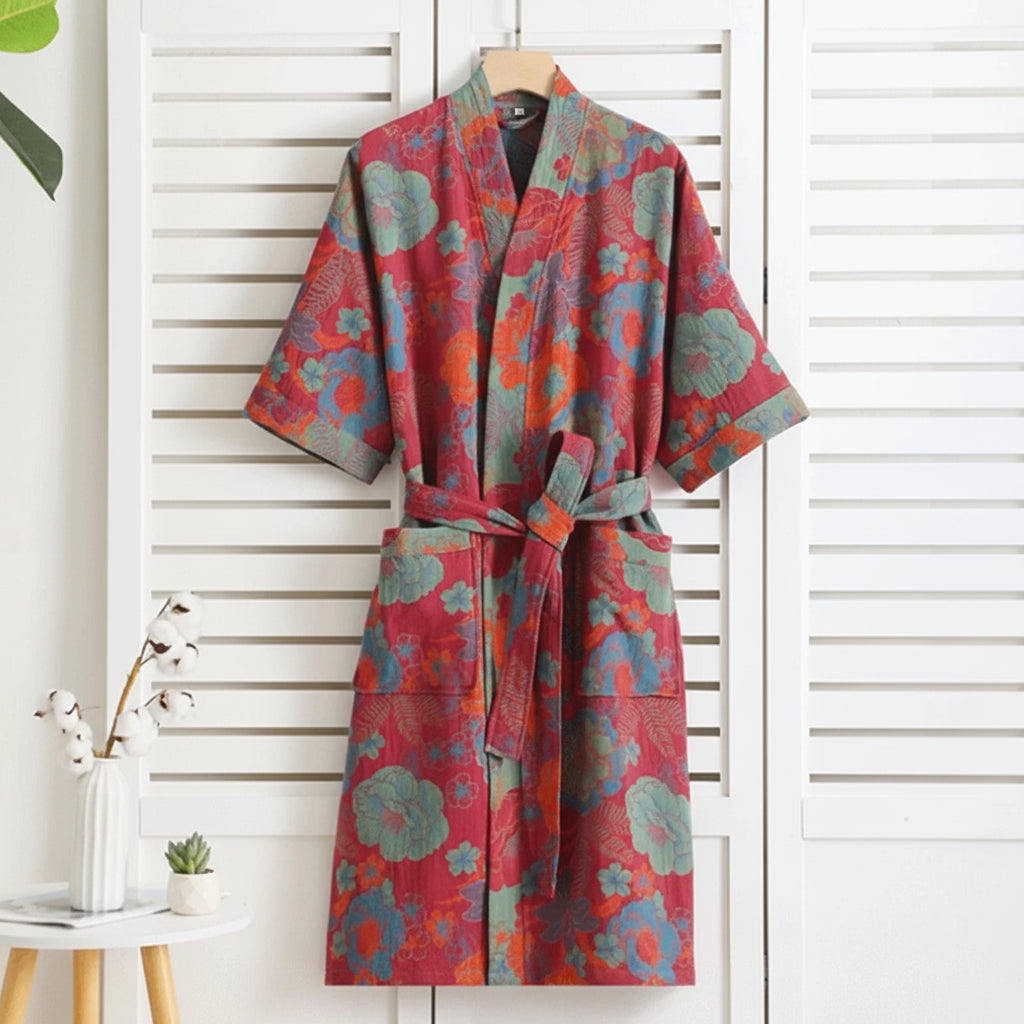 Colorful floral-patterned robe hanging against a white wooden panel background