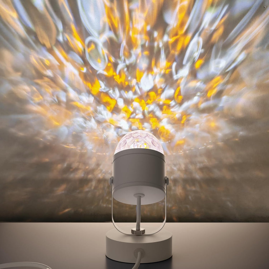Decorative light projector on a table with a colorful abstract background