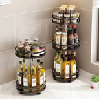 Two tiered kitchen storage racks with bottles and jars on a countertop.