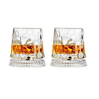 Two glasses of whiskey with a white background