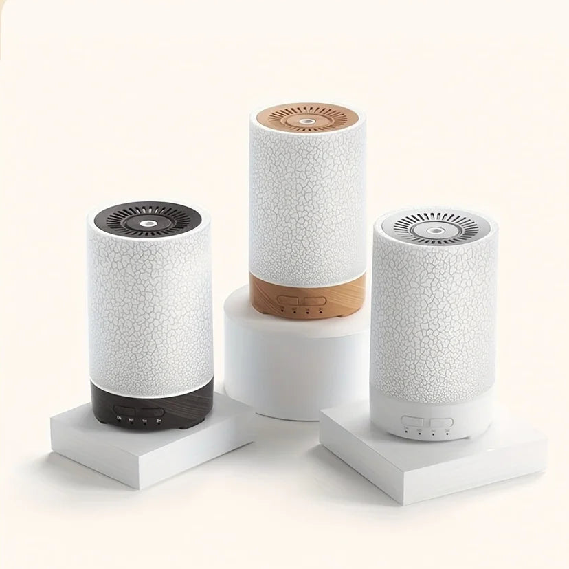 Three cylindrical diffusers on a white background