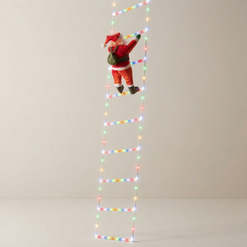 A tall LED light ladder with a small Santa Claus figurine climbing it, photographed against a plain light gray studio background.