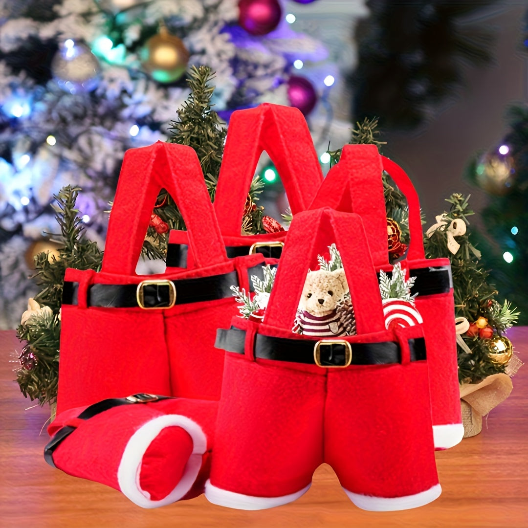 Red Santa suit with black belt and white cuffs on a wooden surface with Christmas decorations in the background.