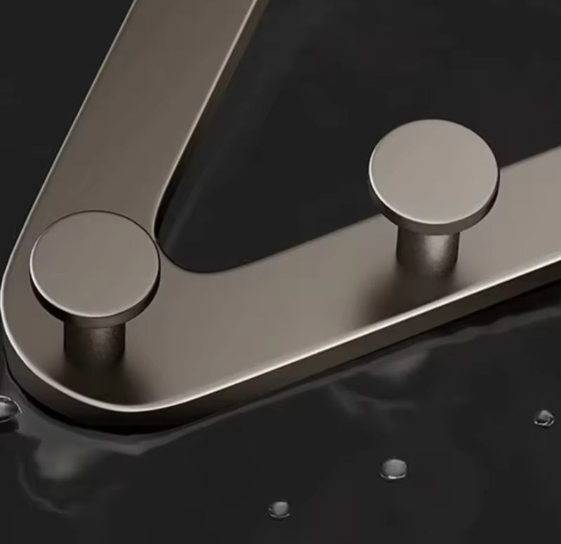 Metallic faucet handle on a dark background
